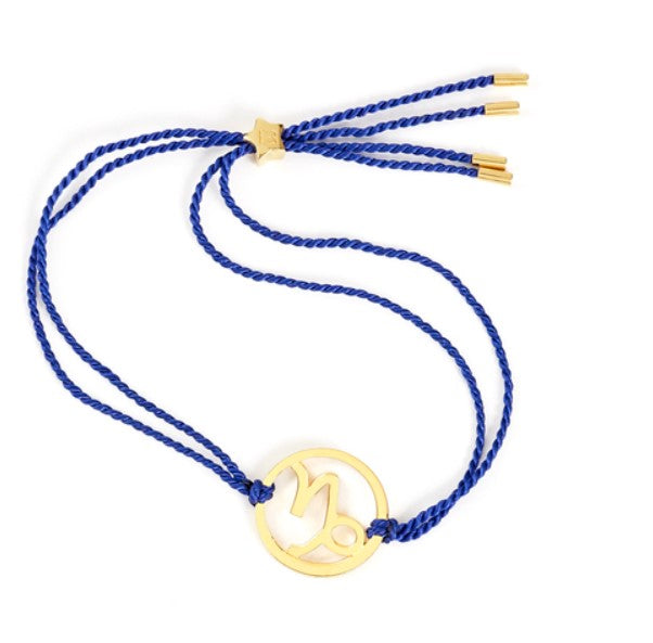 Gold Capricorn zodiac bracelet with blue cord